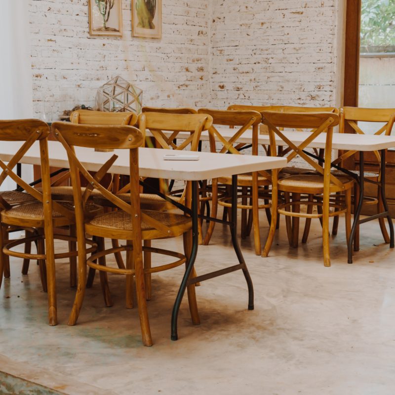 empty wood chair and table in restaurant - vintage effect filter