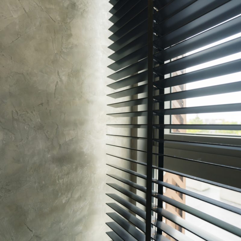 window blind shutter with light shadow and concrete wall